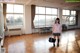 A woman in a school uniform standing in a room.