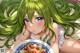 A girl with long green hair laying on a bed with a plate of food.